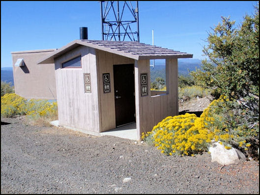 Vault toilet building near lookout