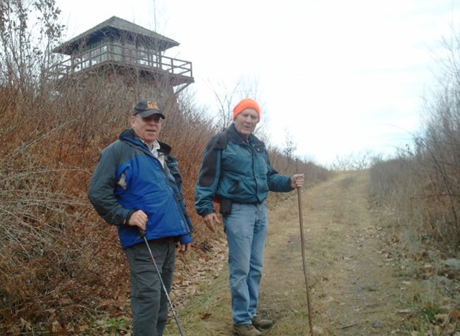 Former USFS rangers Bill Woodland and Charlie Huppuch hiking to High Knob in December 2013
