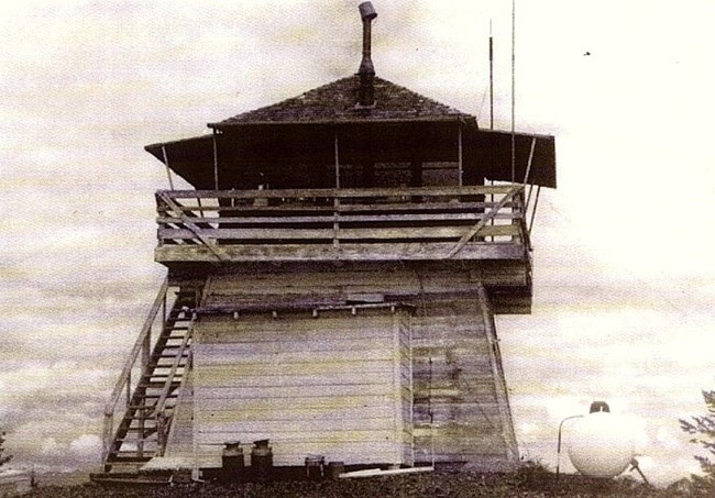 L-4 type cabin on top of an enclosed timber tower - 1975