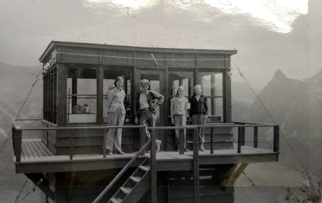 Porcupine lookout with visitors, late 1940s. National Park Service